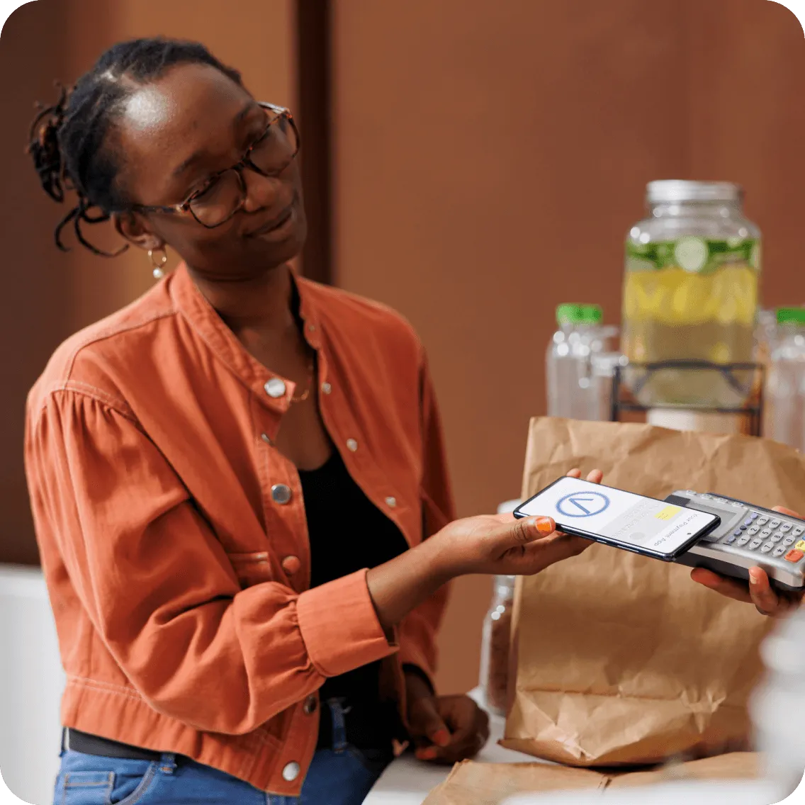 A woman transacting with a POS